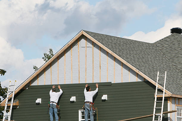 Professional Storm Damage Siding Repair technician working in Barboursville, WV